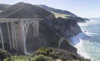 a steep cliff overlooks the ocean in this landscaped view at high speeds in the mountains and cliffs of big sur region