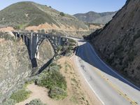 a view of the ocean as a train travels over the bridge over a cliffside