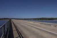 the street bridge runs along the edge of the water, over which is an incline