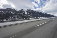 Scenic winter landscape of Germany's Alps with snowy mountains and highway