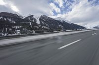 Scenic winter landscape of Germany's Alps with snowy mountains and highway
