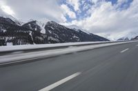 Scenic winter landscape of Germany's Alps with snowy mountains and highway