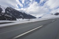 Scenic winter landscape of Germany's Alps with snowy mountains and highway