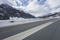 Scenic winter landscape of Germany's Alps with snowy mountains and highway