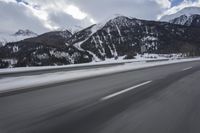 Scenic winter landscape of Germany's Alps with snowy mountains and highway