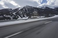 Scenic winter landscape of Germany's Alps with snowy mountains and highway