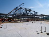 the construction site at the school is being constructed with metal rods and poles as they sit next to the open air