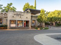 this is an outdoor courtyard area with a fire hydrant and a fountain in the middle