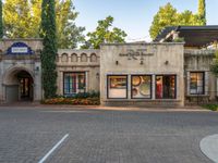 an old fashion store sits at the entrance to a resort, in a neighborhood in italy