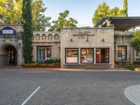 an old fashion store sits at the entrance to a resort, in a neighborhood in italy