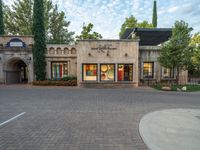 an old fashion store sits at the entrance to a resort, in a neighborhood in italy