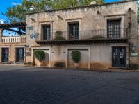 a restaurant is shown on the corner in a plaza area that appears to be old