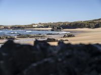 A Serene Beach in Portugal: The Perfect Ocean and Mountain Landscape