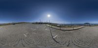 this is a large circular picture of a beach area that is made from stones and has a path on top of it