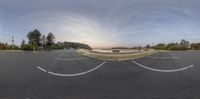 a view of the sky from a fish eye lens with a bench and benches in front