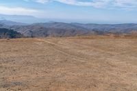 Serene Grassy Plain with Mountains View 004