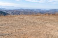 Serene Grassy Plain Mountains View