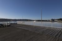 Serene Lake at Dawn with Road Bridge in the City