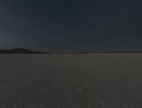 an area of empty open land on a cloudy day with clouds overhead, at the horizon