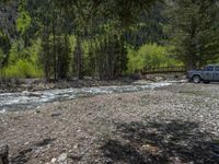 a forest is seen in this wide angle view in this photo from the bottom of the trail