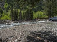 a forest is seen in this wide angle view in this photo from the bottom of the trail