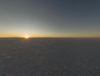 an empty desert with a lone horse at the end of the day's journey