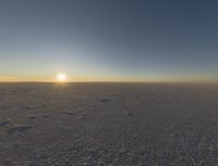 an empty desert with a lone horse at the end of the day's journey