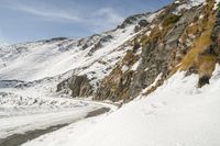 Serpentine Road Through Snowy Mountains in Italy