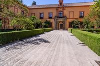 the large brick walkway in front of the entrance is well kept and clean looking to the right