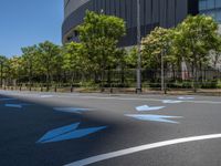 empty road with white lines on the streets of city area against cloudy blue sky on a sunny day