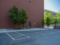 a paved street has been painted light gray, with gray brick walls and concrete edges