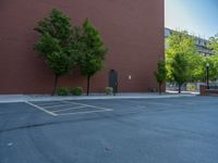 a paved street has been painted light gray, with gray brick walls and concrete edges