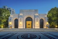 entrance to the lincoln park national memorial center building at night, lit up by light