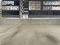 this is an empty concrete parking garage with a yellow fire hydrant in the center of it