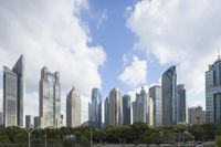 a city street with cars on it and skyscrapers in the distance, in china