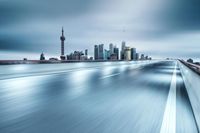 a city skyline in motion with a very long exposure effect, taken by a camera