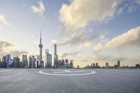 a circular picture of a city skyline with skyscrapers in the distance and an airplane landing strip with a skylight