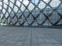 an image of a large building inside a glass structure of glass and a couple of people standing with luggage