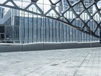 an image of a large building inside a glass structure of glass and a couple of people standing with luggage