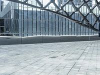 an image of a large building inside a glass structure of glass and a couple of people standing with luggage