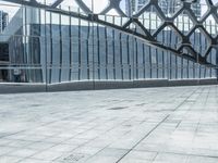 an image of a large building inside a glass structure of glass and a couple of people standing with luggage
