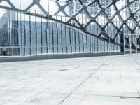an image of a large building inside a glass structure of glass and a couple of people standing with luggage