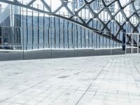 an image of a large building inside a glass structure of glass and a couple of people standing with luggage