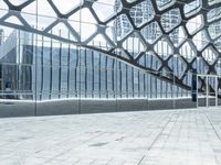 an image of a large building inside a glass structure of glass and a couple of people standing with luggage