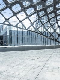 an image of a large building inside a glass structure of glass and a couple of people standing with luggage