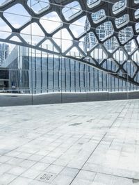 an image of a large building inside a glass structure of glass and a couple of people standing with luggage