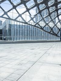 an image of a large building inside a glass structure of glass and a couple of people standing with luggage
