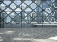 an image of a large building inside a glass structure of glass and a couple of people standing with luggage