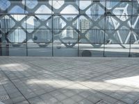 an image of a large building inside a glass structure of glass and a couple of people standing with luggage