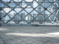 an image of a large building inside a glass structure of glass and a couple of people standing with luggage